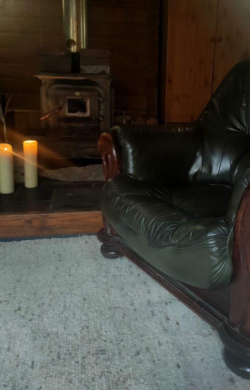 A sofa by the wood burning stove